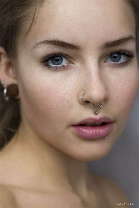 Right Ear Lobe Stretching And Nasal Septum Piercing