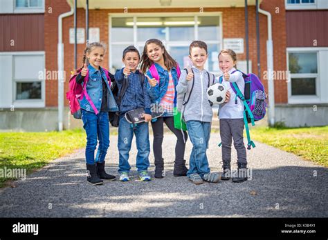 Students Outside School Standing Together Stock Photo Alamy