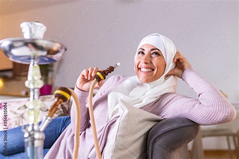 Muslim Woman Smoking Shisha At Home Muslim Young Woman Enjoying While