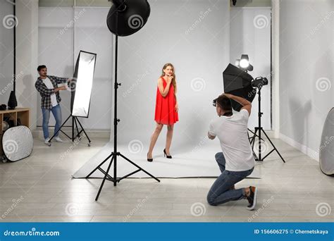 Professional Photographer With Assistant Picture Of Young Woman In