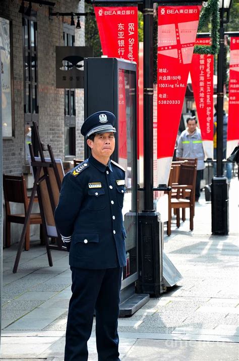 Chinese Security Guard Stands Alert Shanghai China Photograph By Imran