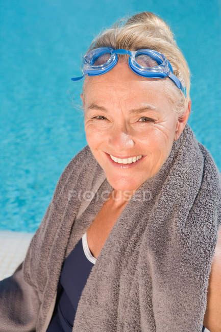 Portrait Of Mature Woman By Swimming Pool Person Headshot Stock Photo