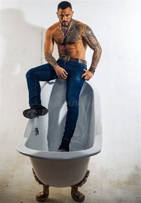 In The Bath Tub Bearded Hispanic Man With Muscular Torso Sitting On