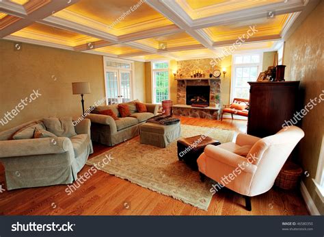 View Of An Upscale Living Room Interior With A Box Beam Ceiling