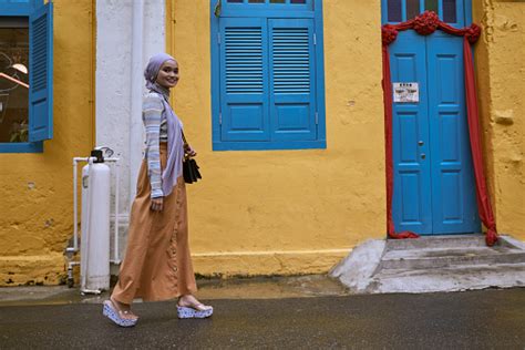 Beautiful Young Asian Muslim Women In Hijab Walking On The Street