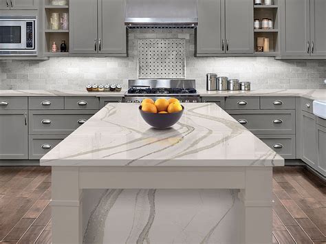 Britannicas Wave Like Pattern Relaxes This Kitchen With Its Warm Gray