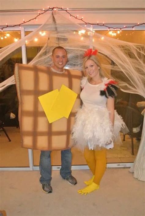A Man And Woman Dressed Up In Costumes Standing Next To Each Other With