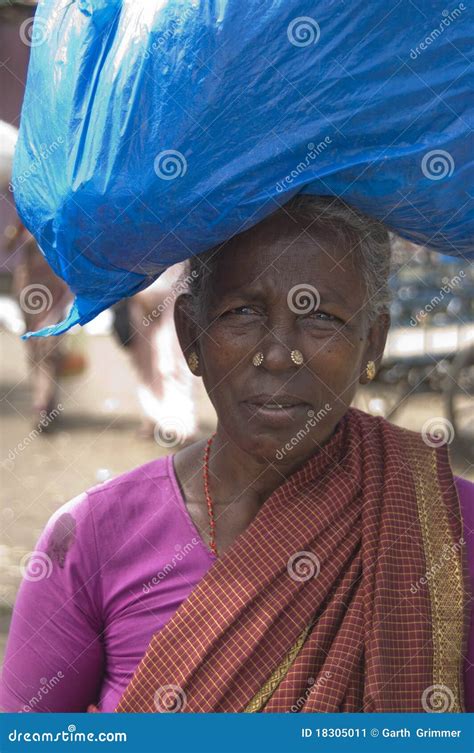 woman carrying load editorial photo image of people 18305011