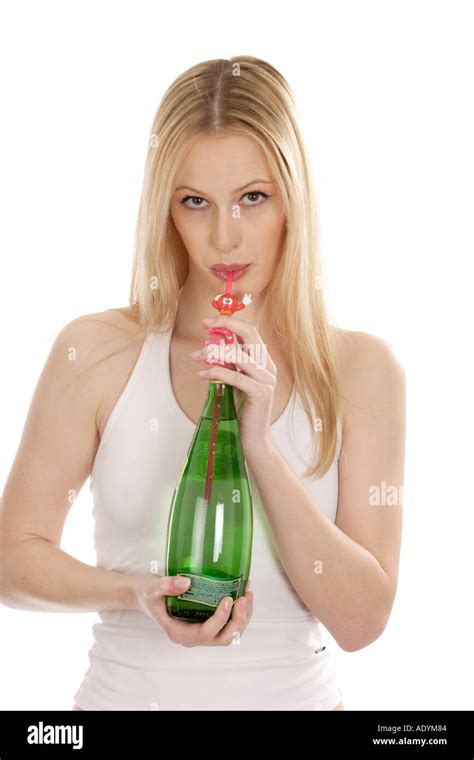 Long Haired Blonde Woman Drinking Water From Bottle With Straw Stock