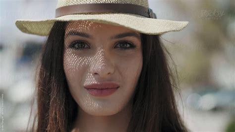 Beautiful Brunette Girl With Plump Lips In Hat By Stocksy