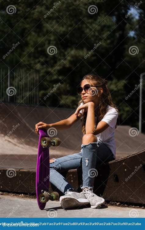 Child With Penny Board Young Girl Teenager In Glasses With Skate Board