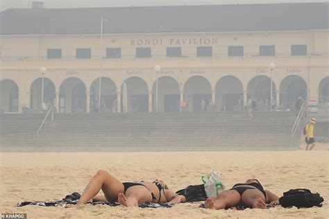 sydney s bondi beach babes strip down to their bikinis and don masks to beat the smoke daily