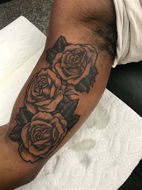 Black and Grey Rose on the inner upper arm | Rose tattoo, Rose tattoo