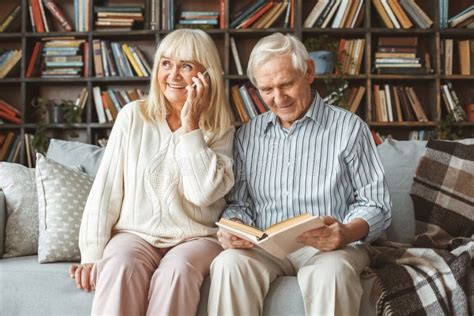 Senior Couple Together At Home Retirement Concept Phone Call Stock