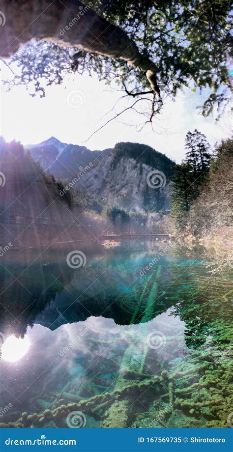 Turquoise Blue Lake With Mountain And Sunshine In Jiu Zhai Stock Image