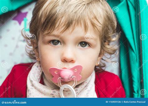 Little Girl With A Pacifier In Her Mouth Stock Photo Image Of Sucking