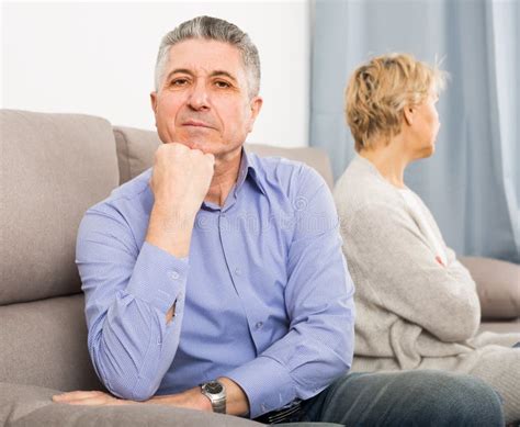 Sad Mature Couple Quarreling At Home With Each Other Stock Image Image Of Incorrectly Dudgeon