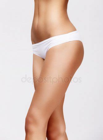 Slim Tanned Womans Body Over Gray Background Stock Photo By