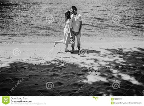 happy stylish couple in love kissing on the beach in summer city stock image image of hugging