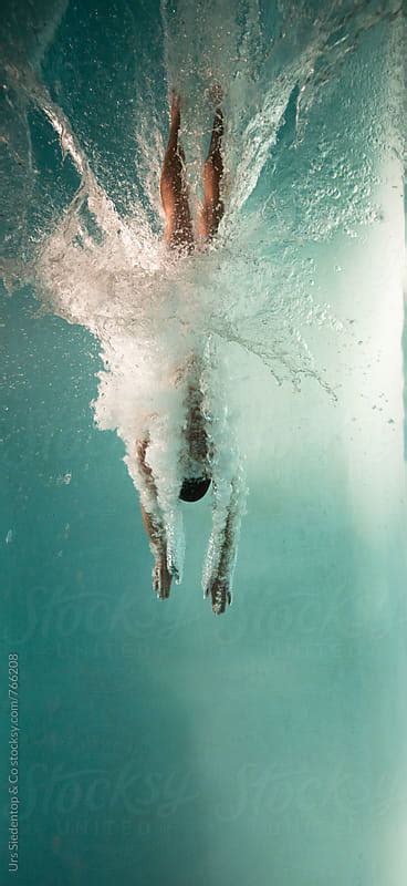 Man Jumps Head On Into Swimming Pool By Urs Siedentop And Co Athlete