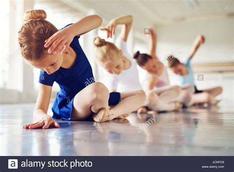 Download This Stock Image Little Ballerinas Doing Exercises And