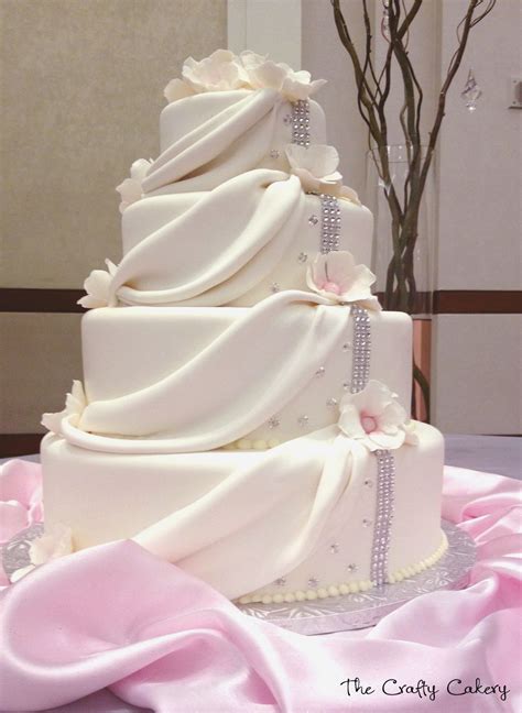 Draped Fondant Wedding Cake With White Flowers And Rhinestone Accents
