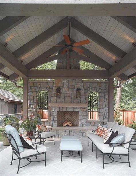 Covered Patio With Pitched Roof And Stone Fireplace Patio