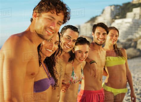 Portrait Of Happy Friends In A Row On Beach Stock Photo Dissolve