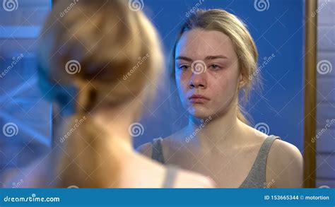 Young Female Suffering Depression Crying Looking At Mirror Reflection