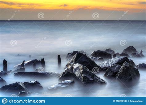 Long Exposure Of A Romantic Seascape With Rocks Stock Photo Image Of