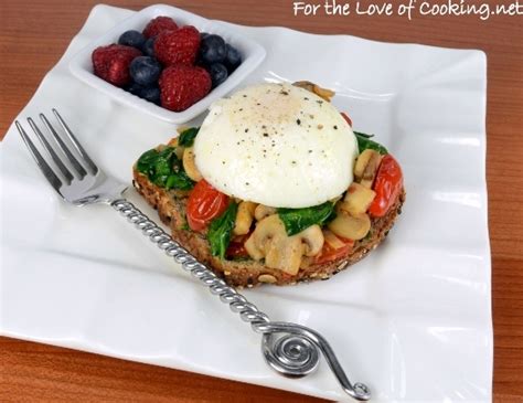 Poached Egg On Toast With Sautéed Mushrooms Tomatoes And