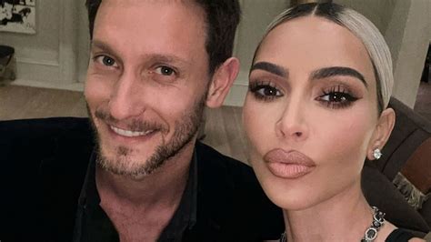 kim kardashian nearly spills out of low cut tank during magical night with male friend in new