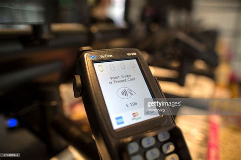 Your contactless credit card is a safe method of payment. Customers Pay With Contactless Cards | Getty Images