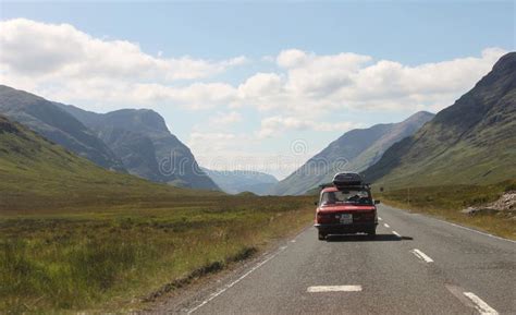 Scottish Highlands Landscape In Summer Old Car On The Road In The