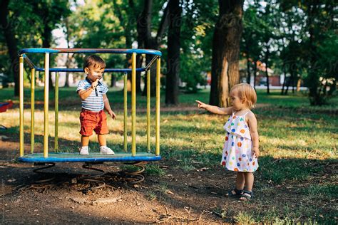 Kids Playing At The Park By Stocksy Contributor Mosuno Stocksy