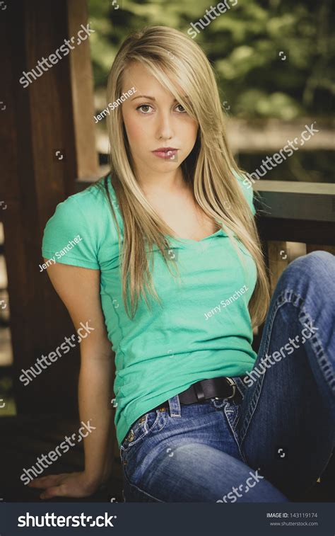 Beautiful Teen Girl Posing In Jeans And Green Shirt Stock