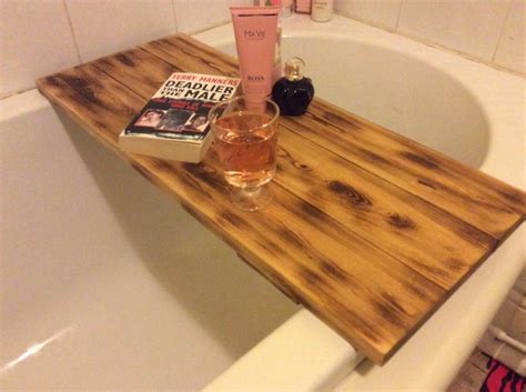 But this bathtub tray also functions as a command center when you're taking a relaxing bath; Wooden Pallet Bath Tub Tray - 101 Pallets
