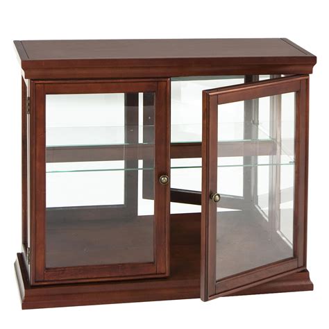 Some curio cabinets are best used for smaller collectible items like glass eggs, figurines, or decorative pieces that beg to sit on display. Small Glass Curio Cabinet Display Case • Display Cabinet
