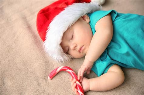 Premium Photo Cute Little Baby In Santa Hat Sleeping On Fabric