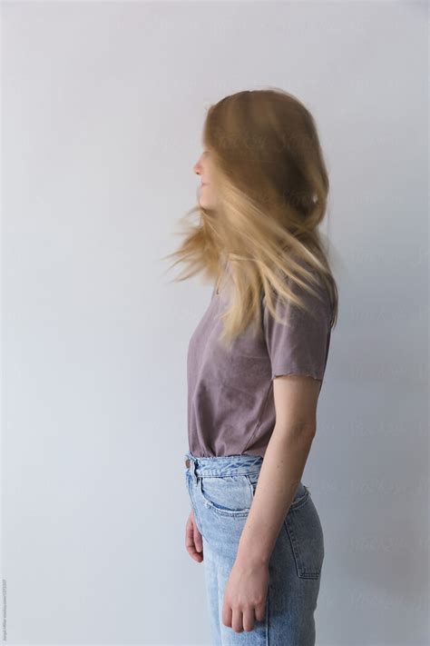 Side View Of Teen Girl With Movement And Blurred Face By Stocksy