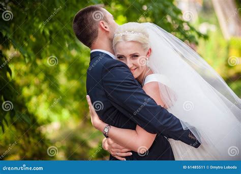 Sweet Wedding The Bride And Groom In An Embrace Stock Image Image Of
