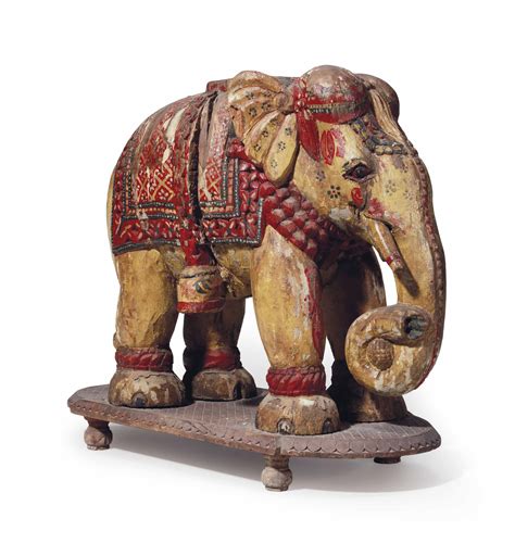 An Indian Polychrome Painted And Carved Wood Model Of An Elephant