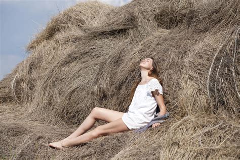 Young Beautiful Woman In The Hayloft In The Village Stock Image Image
