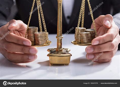 Close Businesspersons Hand Covering Stacked Coins Golden Weighing