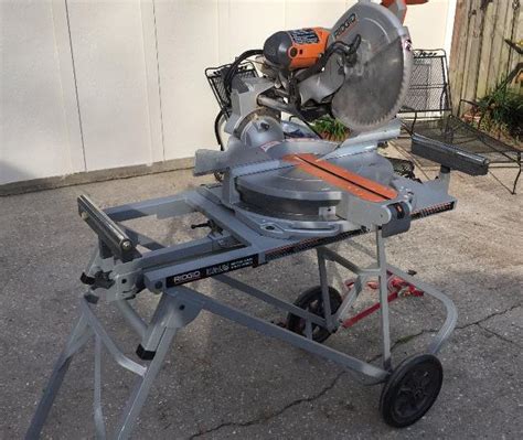 Rent Ridgid 12 Sliding Compound Miter Saw On Rolling Stand In Burien