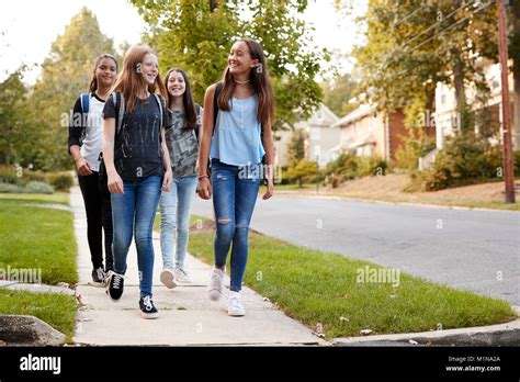Four School Girls Walking Together Hi Res Stock Photography And Images