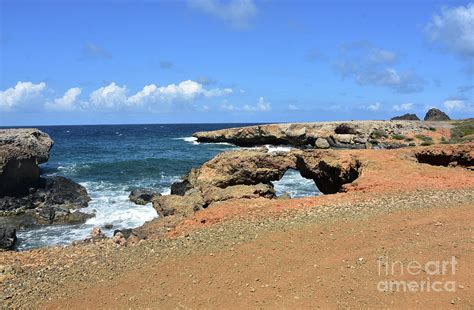 Natural Bridge By Black Stone Beach In Aruba Photograph By Dejavu