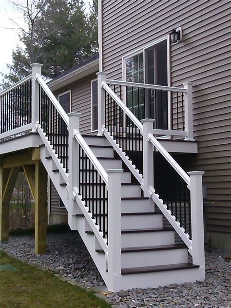 Composite Deck With Black Metal Balusters On White Railings Is Stunning