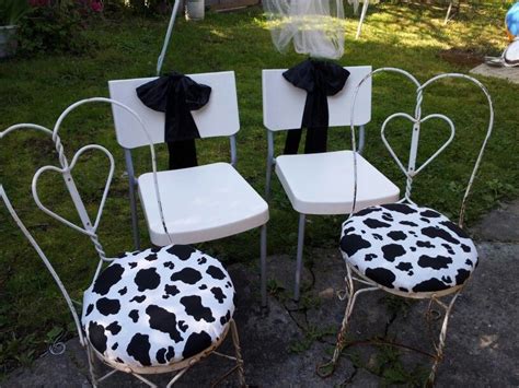 Turn your chair upside down, and remove the seat cushion by unscrewing it. Had left over cow print fabric (was old kitchen curtains ...