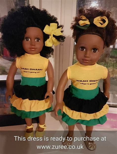 Two Dolls Are Standing Next To Each Other In Front Of A Window With The
